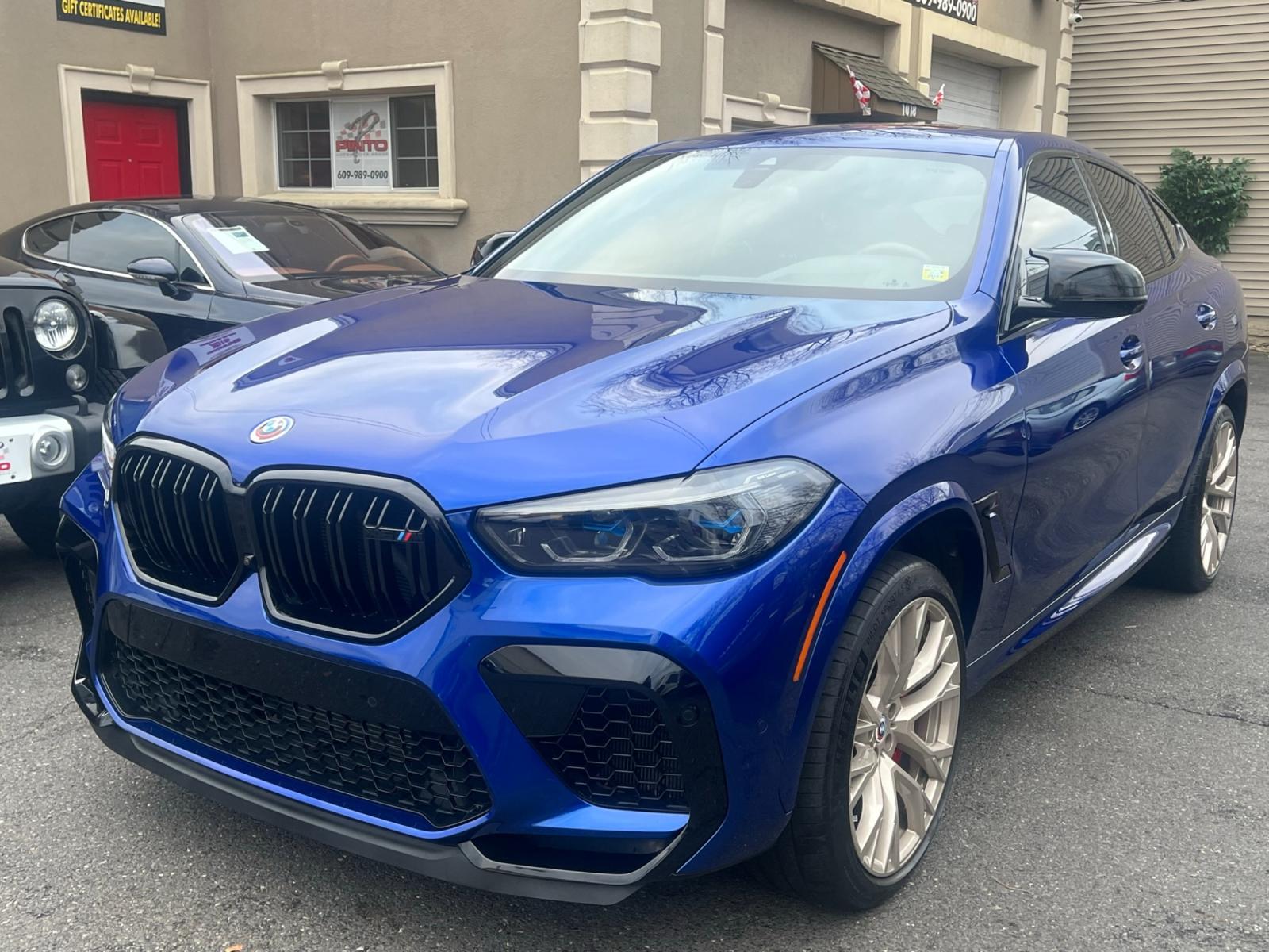 2022 Blue /Red/Black BMW X6 M Base (5YMCY0C07N9) with an 4.4L V8 DOHC 32V engine, 8A transmission, located at 1018 Brunswick Ave, Trenton, NJ, 08638, (609) 989-0900, 40.240086, -74.748085 - Holy Cow and Wow!!...That is the description on this absolutely stunning BMW X6 M Competition! Ordered by Anthony himself with the best color choice of Marina Bay Blue metallic and Red Interior to stand out on the road and to any enthusiast of the BMW X series! Executive Pkg. includes Remote Start, - Photo #0